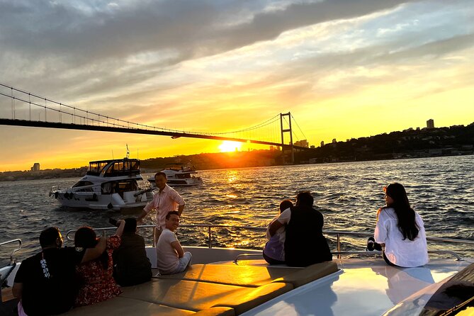 Bosphorus Sunset Yacht Cruise with Snacks and Live Guide - Galata Tower in the distance, Dolmabahçe Palace up close in spirit