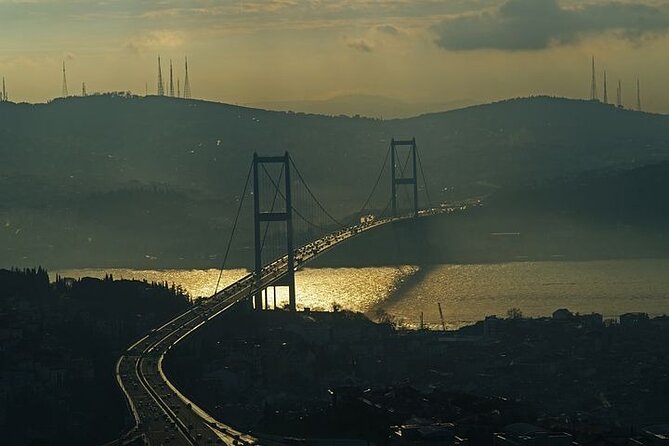 Istanbul: 2 Continents of Bosphorus ( Boat & Lunch ) - Dolmabahçe from the water: mosque, palace, and that clock-tower feel