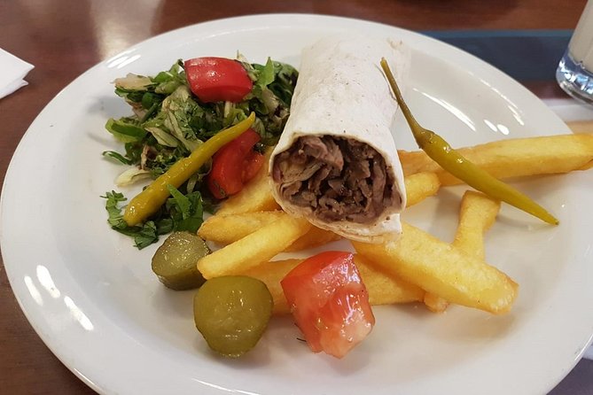 Istanbul Kadikoy Food Tour with 12+ Local Delicacies Tastings - Stop 4 on Güneşlibahçe Sokağı: Lahmacun at a local market, not a tourist booth