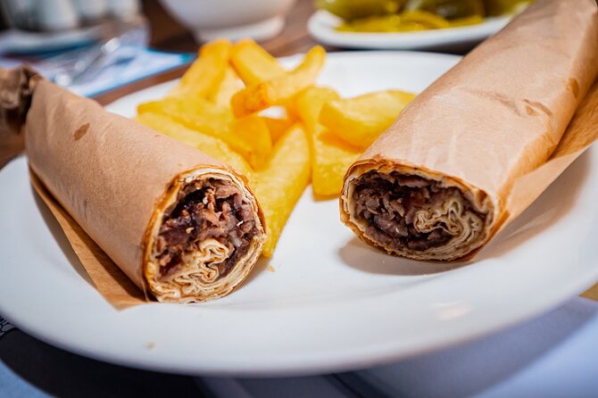 Istanbul Kadikoy Food Tour with 12+ Local Delicacies Tastings - Stop 5 on Arayıcıbaşı Sokak: Umbrella Street, bar street, and the tram meeting point